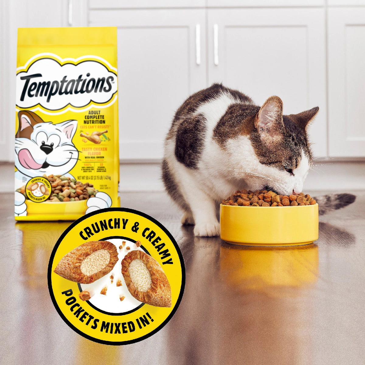 Cat eating TMEPTATIONS crunchy & creamy main meal with pockets mixed in